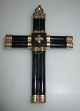 Antique cross 
pendant, 19th 
century. Gold 
plated and 
polished 
Hematite. 9.5 x 
6 cm.