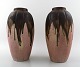 Gilbert 
Metenier, 
French 
ceramist. A 
pair of Art 
Deco pottery 
vases in 
flaming glaze. 
...