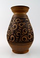 Kähler, 
Denmark, glazed 
stoneware vase. 
1930 s.
Marked.
Measures: 24 
cm. x 12 cm.
In perfect ...