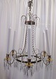 Dansih crystal 
chandelier of 
brass. 20th 
century. For 6 
lights. Chains 
of prisms. A 
total of 226 
...