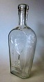 Flask - 
schnapps bottle 
- Funen 
Glassworks, 
1903. Denmark. 
Clear glass. 
Decoration with 
Bissen's ...