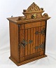 Hanging cabinet 
of oak, 19th 
century. 
Denmark. With 
decorations and 
top. Fittings 
in brass. With 
...