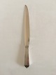 Georg Jensen 
Pyramid Cake 
Knife in All 
Silver No 134. 
830 S. Measures 
26.7 cm / 10 
33/64 in.