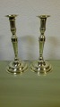 A pair of tall Danish brass candlesticks with loose cuffsStampet LassenCa. From 1815Height 24.5cm.