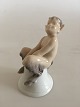 Royal 
Copenhagen 
Figurine of 
Faun on Bell No 
1208. 8.5 cm 
H(3 11/32"). 5 
cm dia (1 
31/32"). In ...