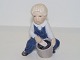 Rare Royal 
Copenhagen 
figurine, boy 
with bucket and 
spade.
Decoration 
number 3519.
Factory ...