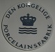 Royal 
Copenhagen 
Dealer sign:  
Den Kongelige 
Porcelainsfabrik 
Commercial 
Plate ca 26 cm  
In mint ...