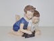 Lyngby figurine, boy and girl with turtle.Decoration number 4A.Measures 14,0 by 10.0 ...