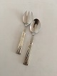 "Champagne" 
O.V. Mogensen 
Silver and 
Stainless Steel 
Small Salad 
Servers. 13.5 
cm L (5 5/16")