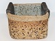 Richard Manz aert pottery.Square jar with folded edges and different glazes.From his own ...