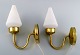 HANS-AGNE JAKOBSSON, a pair of wall lamps, 1960s, opal glass screens.Height approx. 30 cm.In ...
