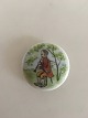 Royal 
Copenhagen 
Porcelain 
Button with 
Handpainted 
Motif of 
Musician. 3 cm 
dia
