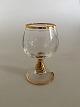 Holmegaard 
"Ida" cognac 
glass with Gold 
on Stem, Rank 
and Foot. 
Measures 9.2 cm 
/ 3 5/8 in. 
High ...