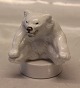 Royal 
Copenhagen 
Stoneware 22746 
RC Polar bear 
cub sitting 
with paw to paw 
on round base 
(# ...