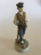Royal 
Copenhagen 
Figurine of 
Farmer Boy with 
Hammer No. 620. 
21 cm H. 1st 
Quality. In 
nice whole ...