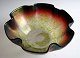 Art Nouveau 
bowl in 
irradiated 
glass, 
approx.1900. 
With wavy edge. 
Opaque glass 
with overlay in 
...