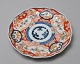 Japanese Imari 
porcelain plate 
decorated with 
plant 
ornamentation. 
19th century. 
Diameter: 22 
cm.