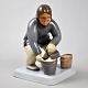Bing & Grondahl 
porcelain 
figure, 
Greenlandic 
woman with 
bucket, 2416, 
20th century, 
Copenhagen, ...