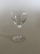 "Kirsten Pil" 
Schnapps Glass 
form 
Holmegaard. 8.5 
cm H. The glass 
is ingraved 
with round 
shaped ...