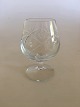 Holmegaard Ulla 
Cognac Glass. 
Measures 9 cm 
H. Glass with 
cut and cross 
grinding and 
smooth stem.