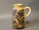 Ceramic jug in 
brown colors 
with bird 
motifs by 
Michael 
Andersen & Son, 
numbered 6427.
H - 19 ...