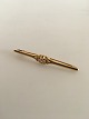 Georg Jensen 
18K Gold Brooch 
No. 237 
ornamented with 
small diamond. 
5.3 cm L. 
Weighs 5 grams 
...