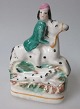 Staffordshire 
figure of 
riding man, 
approx. 1840. 
England. 
Polycrom 
painted. 
Height: 11 ...
