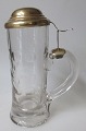 German drink 
glass, approx. 
1900. Clear 
glass. 
Mouth-blown. 
Decorated with 
circles. With 
handle ...