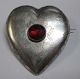 Ancient Danish 
heart-shaped 
brooch in 
silver, 19th 
century. With 
red glass flus. 
With engraved 
...