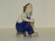Bing & Grondahl 
figurine, boy 
holding his 
shoe.
The factory 
mark tells, 
that this was 
...