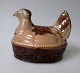 Bornholm Saving 
pare Hen, 19th 
Century. 
Denmark. Hen 
lying on eggs. 
Brown Glazed. 
Length: 11 ...