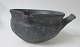 Black clay pot 
with handle, 
Denmark, 19th 
century. With 
decoration on 
the sides. 
Height: 8 cm. 
...