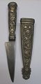 Antique Argentine dagger, 19th century sheath and gilded metal handle. Decorated with flowers. ...