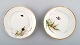 2 antique b & g 
bing & grøndahl 
plates. Hand 
painted with 
butterfly and 
insect.
Measures: 16.5 
...