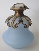 French perfume 
bottle, 19th 
century. Light 
blue opal 
glass. With 
brass mounting. 
With miniature 
...
