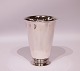 Simpel vase on 
foot, stamped 
KCH and in 
hallmarked 
silver.
H - 16 cm and 
Dia - 11,5 cm.