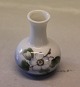 Royal 
Copenhagen 
863-1258 RC 
Miniature vase 
6 cm with fruit 
flawer
 In mint and 
nice condition
