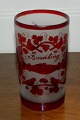 High-
cylindrical 
glass with the 
Hungarian text 
for friendship 
"Barátság". The 
glass have red 
...