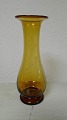 Amber-colored 
flower glass / 
hyacinth 
glassBaluster-
shaped on ring 
base Holmegaard 
1880Height ...