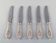 Five danish 
silver dinner 
knives, approx. 
1920.
Stamped. "JS" 
three towers 
(.830)
Measures: ...