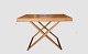 Folding table 
with leather 
strap. Drawn in 
1960 
Rus Rasmussen 
Pear wood 
Contact us 
regarding ...