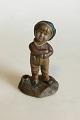 Stoneware 
Figurine of 
Boy. With 
Candle Holder. 
Signed, 1933. 
Measures 13.5 
cm / 5 5/16 in.