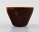 Saxbo stoneware 
vase in modern 
design, glaze 
in brown 
shades.
Stamped Saxbo. 
Ying ...