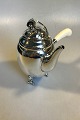 Georg Jensen 
Sterling Silver 
Blossom Coffee 
Pot with Ivory 
Handle No. 2D. 
21 cm H 
(8.26"). ...