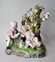 German 
porcelain 
figure, 19th 
century. A boy 
wakes a girl by 
a tree. 
Stamped. 18 x 
20 ...