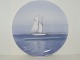 Royal 
Copenhagen 
plate with 
sailboat on 
ocean.
The factory 
mark tells, 
that this was 
produced ...