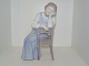 Rare Bing & 
Grondahl Art 
Nouveau 
figurine, woman 
on chair.
The factory 
mark tells, 
that this ...