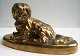 Bronze figure of lying dog on oval foot, 19th century. L .:16 cm. D: 6.5 cm. H: 8.5 cm. ...