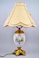 French table 
lamp in 
porcelain and 
gilded bronze. 
19th century. 
Porcelain 
decorated with 
flowers ...