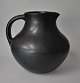 Nielsen, 
Christian (20th 
Century) 
Denmark: 
Pitcher. Black 
glaze. With  
handle. Signed. 
Height: ...